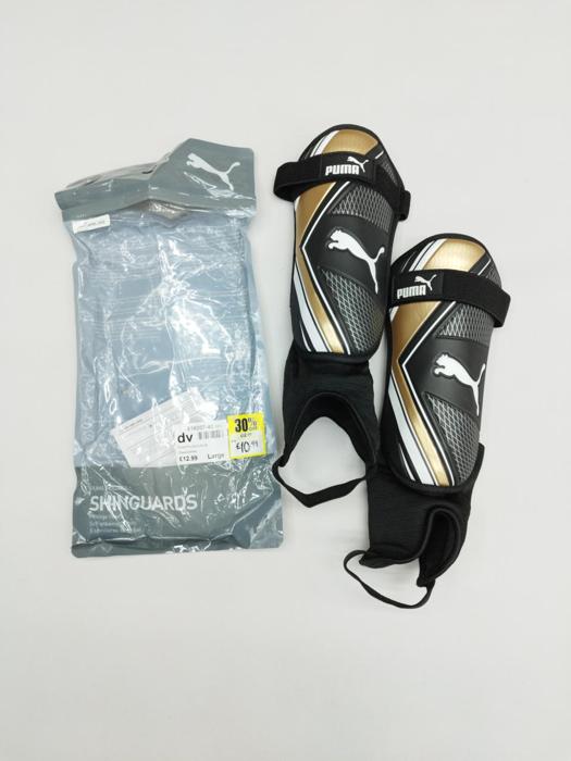Фото Футбольні щитки Puma